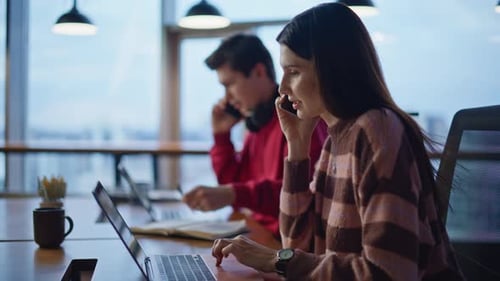 Service Desk Operators Working in Call Center Workplace Looking Laptops Closeup