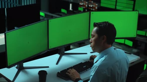 Asian Man Having Headache While Working With Mock Up Multiple Computer Monitor In office