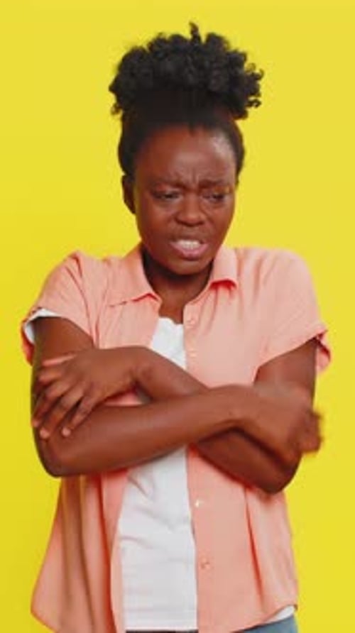 Black Woman Scratching Arm and Neck Irritated Expression Allergy Symptoms Discomfort Reaction