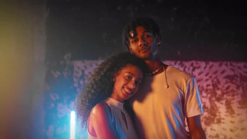 Smiling Couple Standing Closely Together