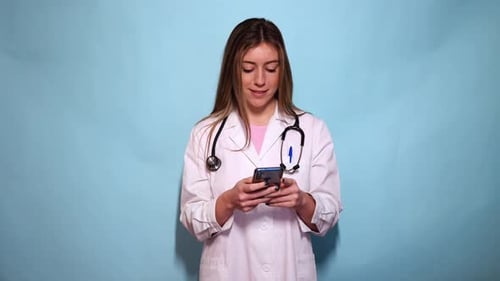 Female Doctor Using Smartphone in Studio Setting