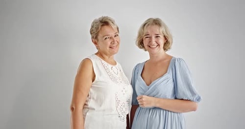 Two Women Smiling Together Indoors