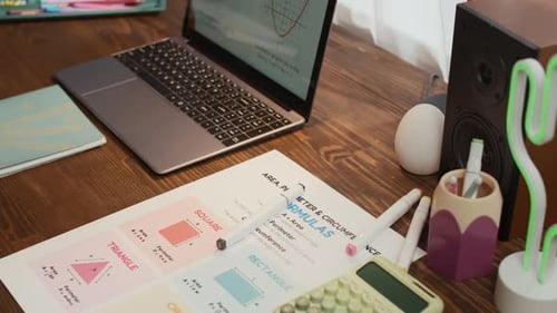 Laptop, Notebooks and Calculator on Wooden Tablet
