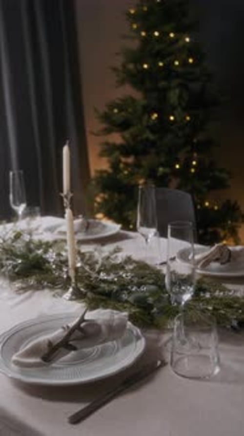 Holiday Table in Room Decorated with Christmas Tree