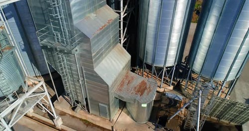 Grain warehouse, granary. Large steel towers for storing crops. Large animal feed factory