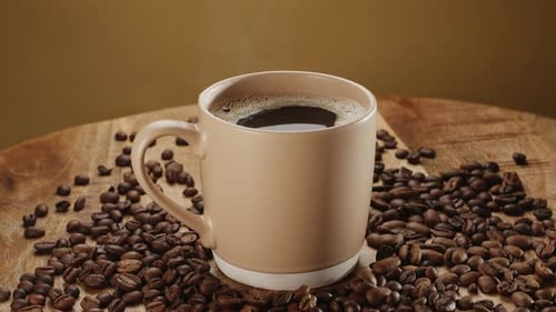 Steaming Coffee Mug Surrounded by Coffee Beans