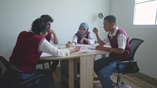 Asian High School Students Discussing Together