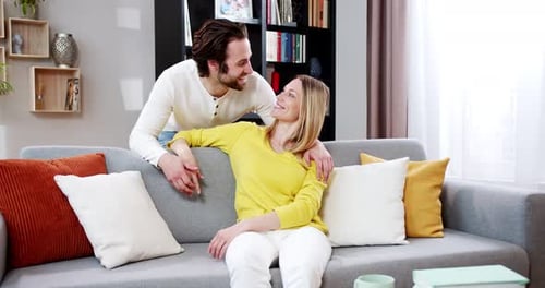Affectionate Couple Sharing Romantic Moment on Couch