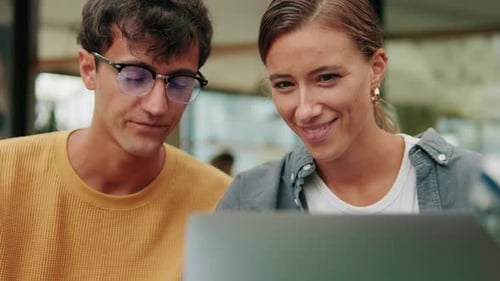 Close up of students of different nationalities use modern technology, laptop for studying