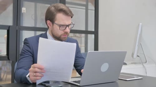 Business Man Working with Documents in Office