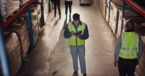 Man, tablet and industry in warehouse for logistics, quality control and stock management