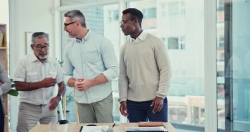 Team Meeting Around a Table in a Workplace