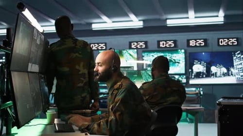 Soldier Solving Tasks in Military HQ Base Gathering Information on Enemy Troops