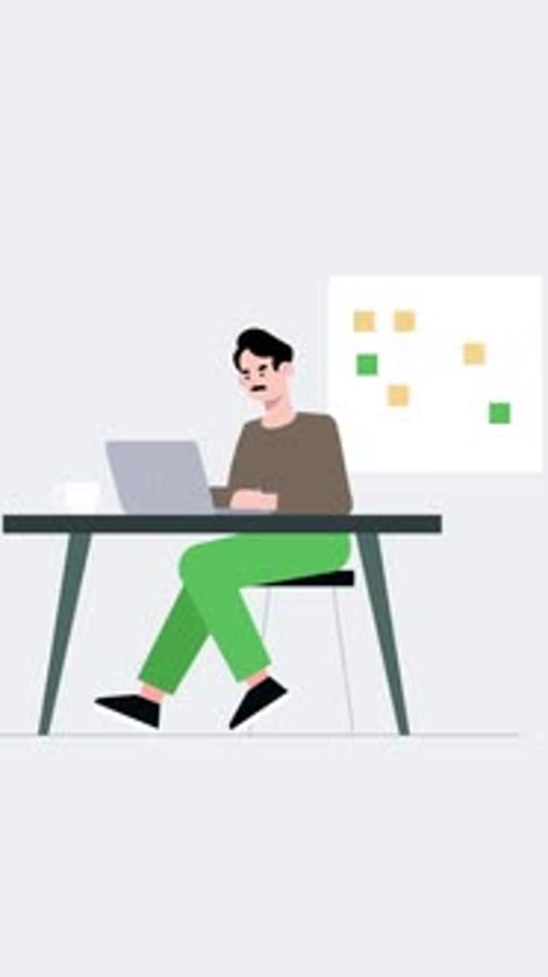 A Mustachioed Male Employee Working In The Office Is Working On A Project On His Laptop Vertical