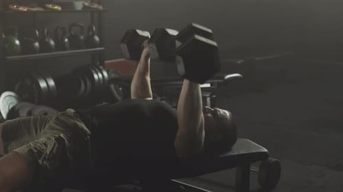 Man exercising with dumbbells