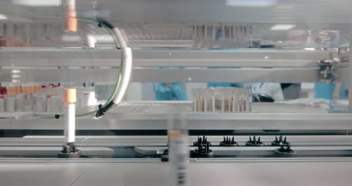 Automated laboratory machine processes vials in modern lab