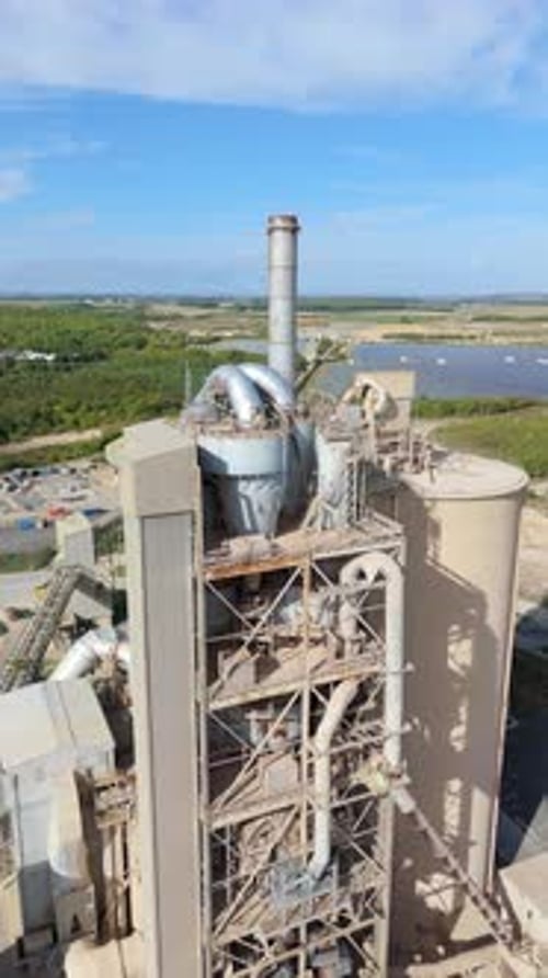 Aerial view of industrial plant and chimney, United Kingdom.