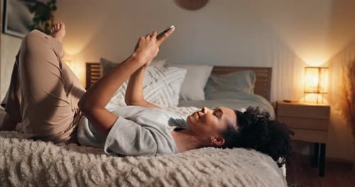 Smile, night and woman in bedroom, smartphone and typing with connection, relax and social media