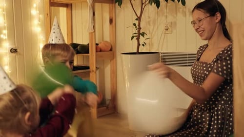 Family Fun: Children Celebrating Birthday with Balloons