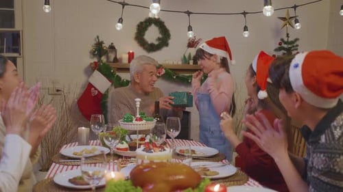 Family Celebrates Christmas Together with Gifts