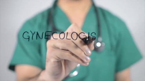 Doctor Writes Gynecologist on Glass Surface