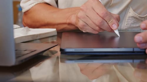 Close Up of Person Using Tablet and Stylus
