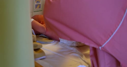 Newborn Infant in Hospital Receiving Care