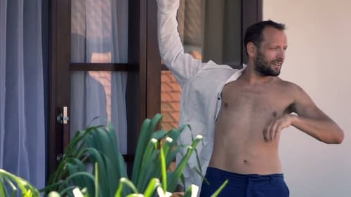 Man Putting On Shirt Standing On Terrace, Super Slow Motion 240fps
