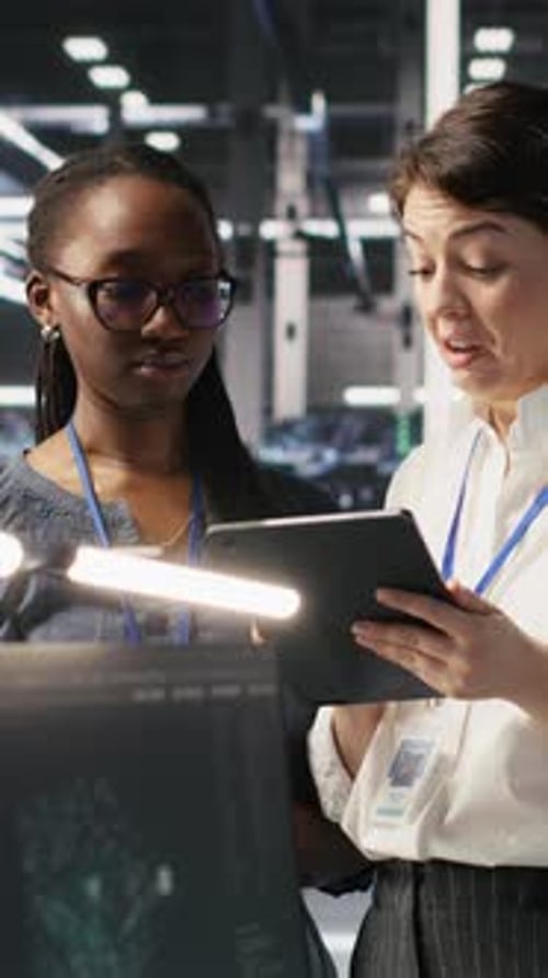 Vertical Video Teamworking Engineers in Data Center Integrating AI Automation Tools