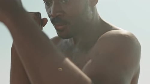 Man Boxing Outdoors Under Bright Sunlight