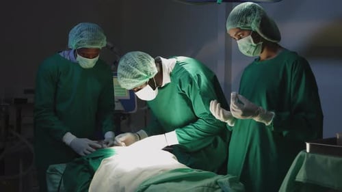 Surgeons Performing Surgery in Operating Room