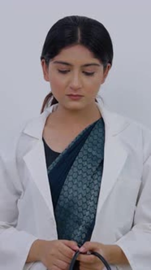 Vertical Video of Sad Indian Female Doctor Removing Stethoscope and Feeling Bad