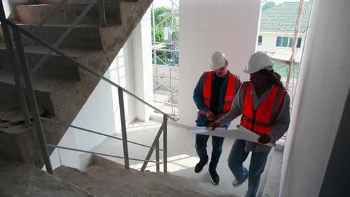 Team architect or engineer looking blueprint for inspection and planning construction.