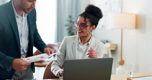 Business People Reviewing Documents in Modern Office