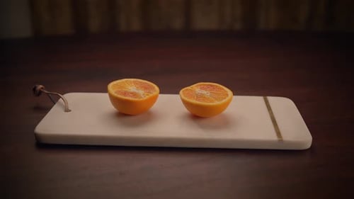 Freshly Cut Oranges on a Beautifully Crafted Wooden Board Ready for Any Occasion