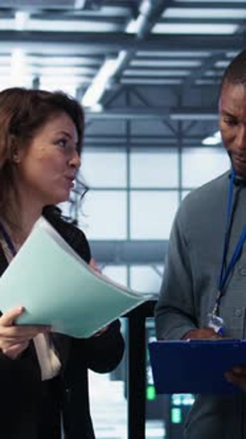 Vertical Video Data Center Management Executives Reading Paperwork Files