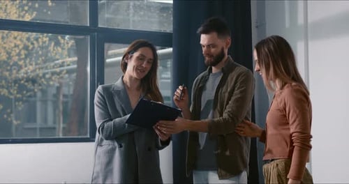 Signing Property Contract Happy Young Man and Woman Making Deal with Real Estate Agent Buying New