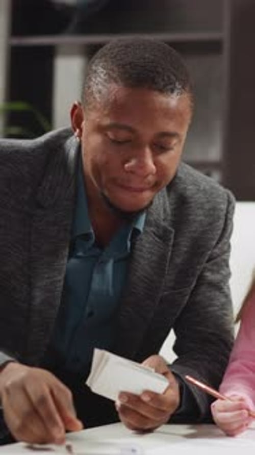 Black Teacher Shows Cards Telling Letter Names to Children