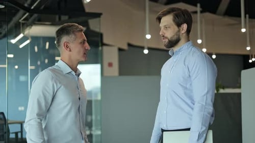 Business People Shaking Hands in an Office