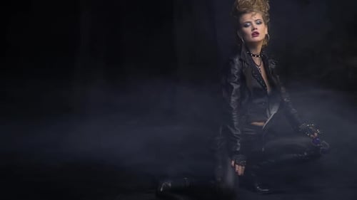 Fashionable Woman with Blonde Teased Hair Posing