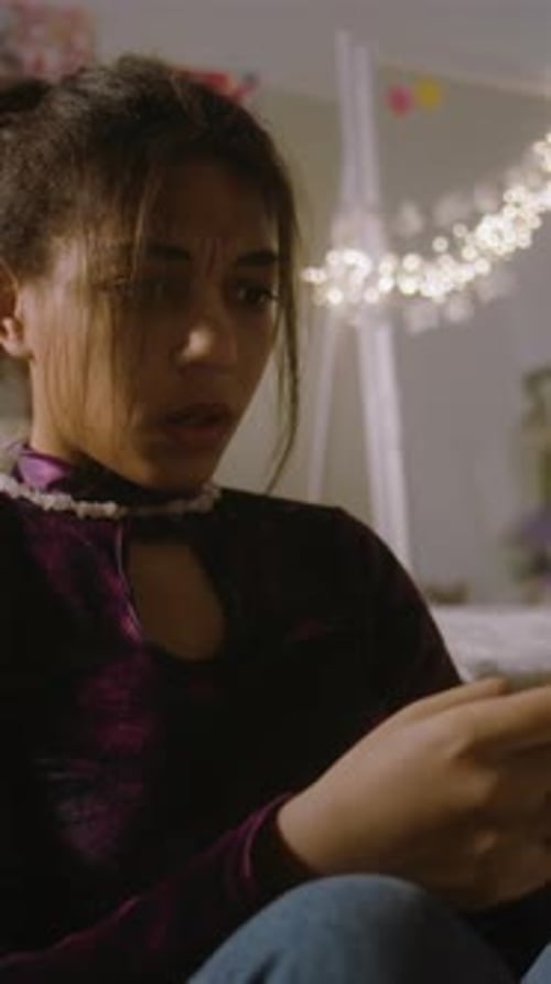 African American Girl Screams and Emotionally Type on Phone