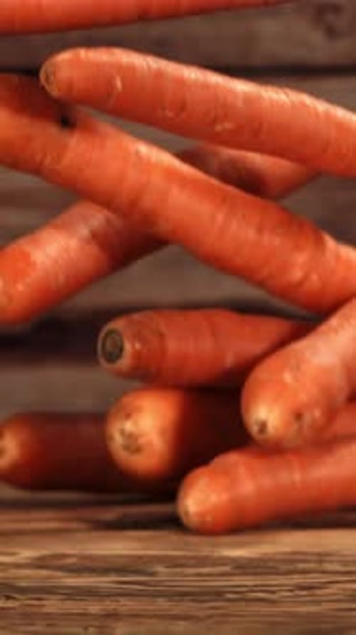 Falling Carrots on the tableFilmed is Slow Motion 1000 Fps