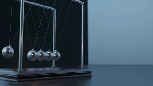 Swinging Pendulum Balls with a Bus Passing By Newtons Cradle