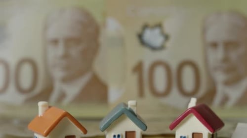 Canadian real estate three houses on money