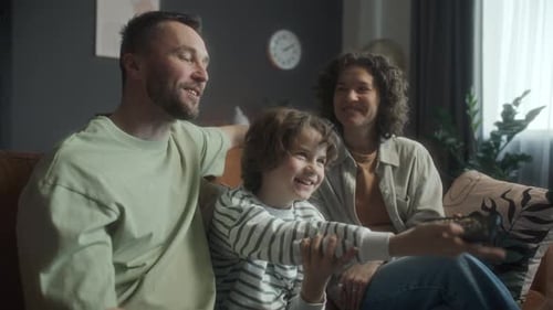 Family Watching Television in the Living Room Together
