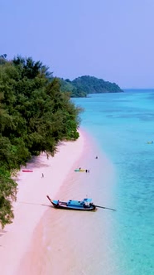 Koh Kradan Island Southern Thailand with Longtail Boats at the Beach and a Turqouse Colored Ocean