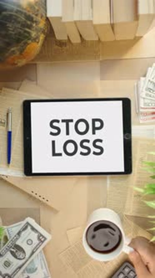 VERTICAL VIDEO OF STOP LOSS DISPLAYING ON FINANCE TABLET SCREEN