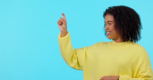 List, options and pointing with a black woman on a blue background in studio for instructions