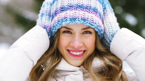 People, Season And Leisure Concept - Portrait Of Happy Smiling Woman Outdoors In Winter