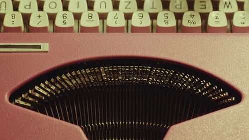 Hands of Author Typing Novel on Vintage Typewriter